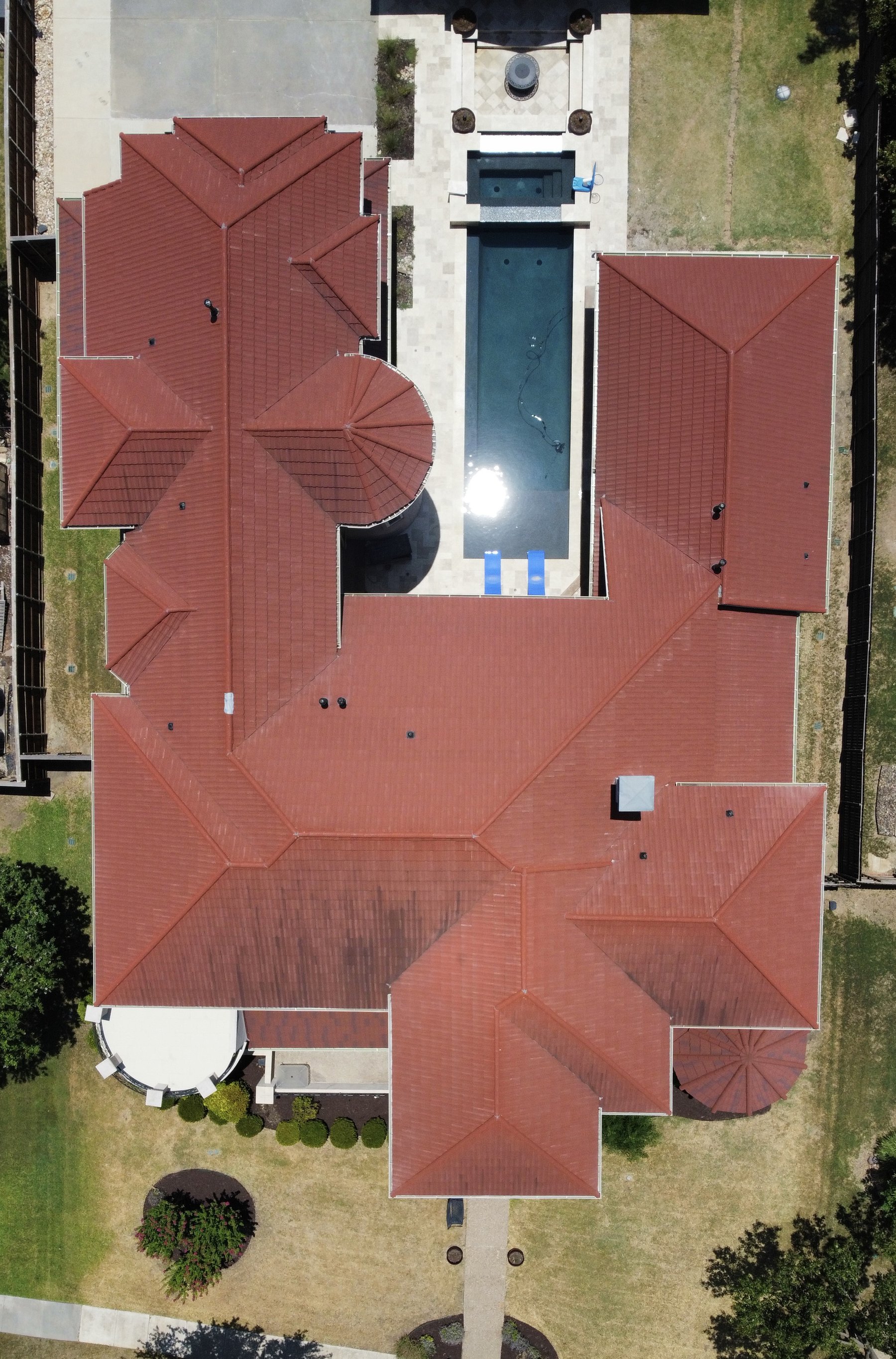 Castle Hills residence before restoration — storm-damaged roof